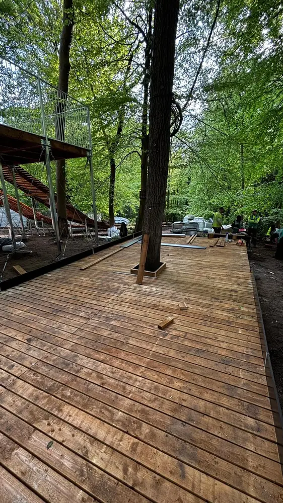 Wooden deck path at the entry and exit area of a tubing slide