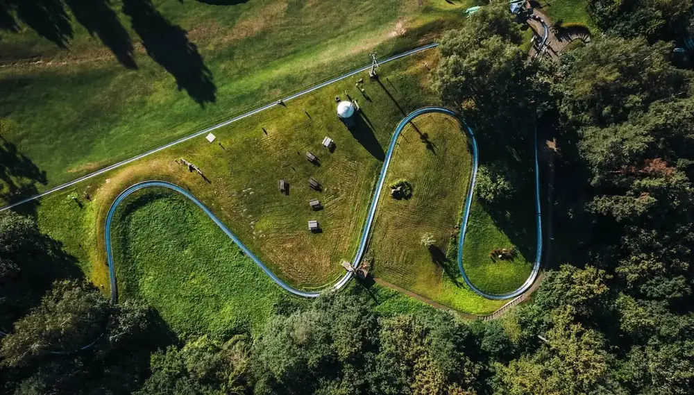 Aerial view of the Rāmkalni summer toboggan run with seven curves