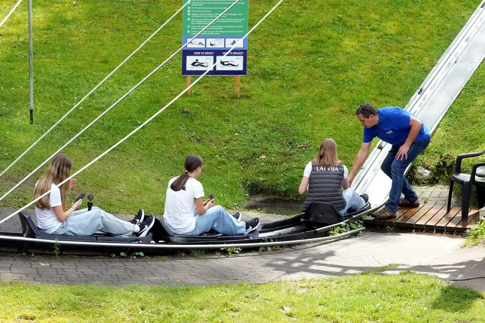 Riders on sleds at the start of the Rāmkalni toboggan run